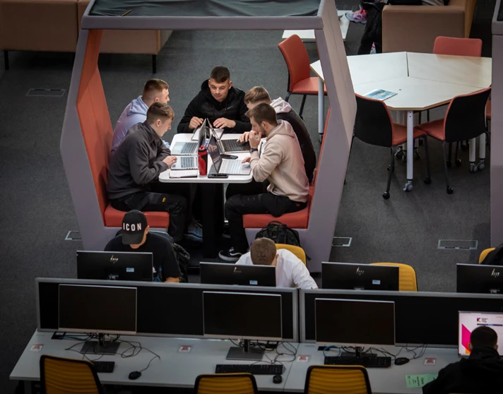 Group of male students working together on laptops in a study pod at Glasgow Kelvin College’s Springburn campus, with others using nearby desktop computers. Group of male students working together on laptops in a study pod at Glasgow Kelvin College’s Springburn campus, with others using nearby desktop computers.